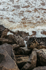 wave on the beach in the late sunset