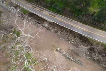 Broken Highway road damaged Destroyed Flooded River, Ojai, California, Ventura River disaster Rain Storm Aerial
