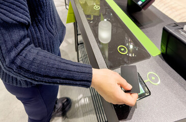 Woman buying make up at cosmetics section in store,self checkout systems in  retail stores,Barcode scanner,Self checkout machine