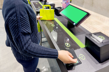 Woman buying make up at cosmetics section in store,self checkout systems in  retail stores,Barcode scanner,Self checkout machine
