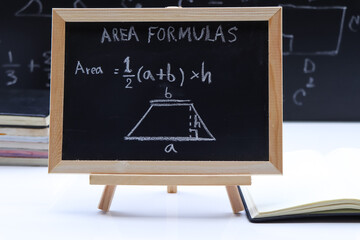 Blackboard with hand written geometry area formulas