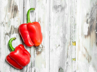Two fresh sweet red peppers.