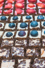 Repeating rows of assorted sweets at a tea party