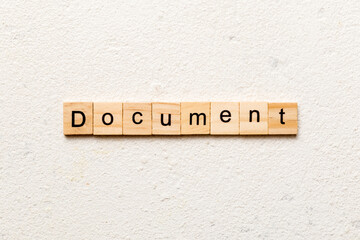 Document word written on wood block. Document text on cement table for your desing, concept