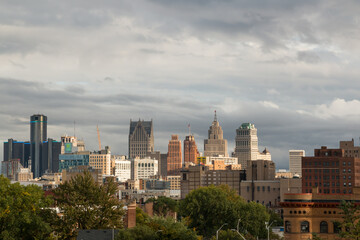Fototapeta premium View of landmark downtown Detroit, Michigan skyline as seen from the Cass corridor midtown area. Shot during a sun and clouds mixed afternoon. September 2022.