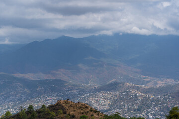 Beautiful view of the large Mexican city of Oaxaca from Monte Alban. View of the endless mountain peaks.