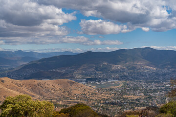 Beautiful view of the large Mexican city of Oaxaca from Monte Alban. View of the endless mountain peaks.