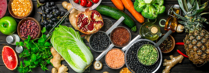 Organic food. Variety of healthy fruits and vegetables with legumes .