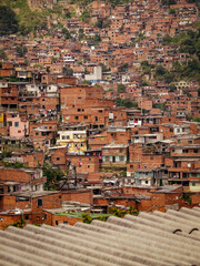 The comuna 13 neighborhood in Medellin, Colombia has transformed from a former ghetto to a well-developed area, with stacked houses as a unique feature.