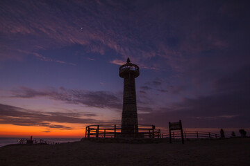 Fototapeta premium LIGHTHOUSE IN A SUNSET IN LA CHOCOLATERA, SALINAS, ECUADOR