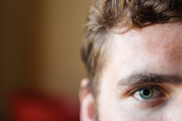 Eyes green young man. Young beautiful freckles curly woman face portrait with healthy skin. healthy...