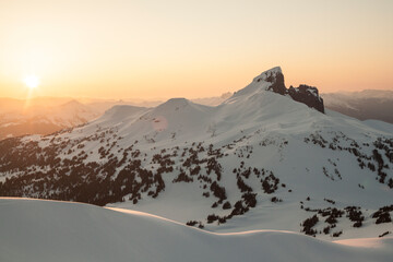 View of mountains in snow at scenic sunset