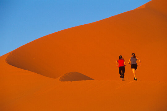 Running in desert, Erg Chebbi, Morocco