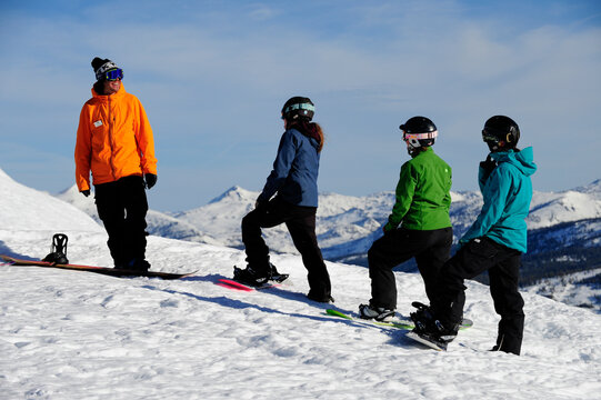 A snowboard instructor speaks to his students at a mountain resort near South Lake Tahoe, California.
