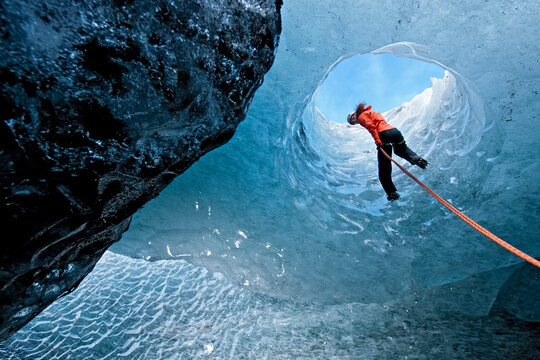woma rappelling into glacier cave on S&oacute;lheimaj&ouml;kull glacier in Iceland