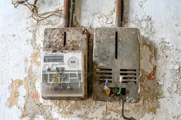 Old electric meter in building. 