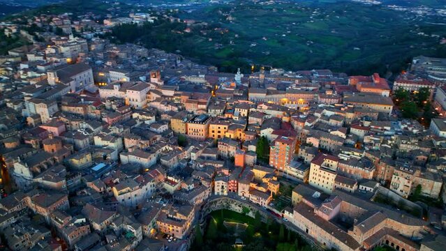 aerial view of Perugia at sunset, capital of Umbria, Tuscany, in central Italy, flying above historic medieval old village, UNESCO World Heritage site in Italy