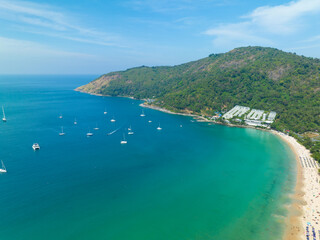 Fototapeta na wymiar Aerial View Amazing beach with travel people relaxation on the beach,Beautiful sea in summer season at Phuket island Thailand,Travel people on beach,Beach during summer with many resting people