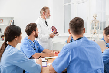 Doctor giving lecture for interns in university