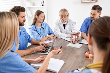 Doctor and interns on lecture in university