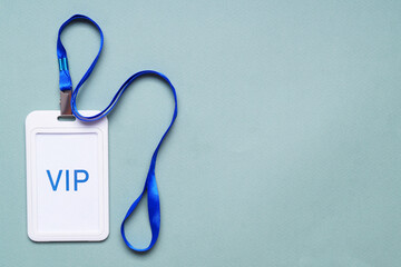 Plastic vip badge on light background, top view. Space for text