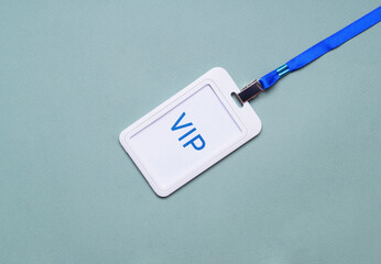Plastic vip badge on light background, top view