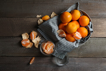 Many fresh ripe tangerines on wooden table, flat lay
