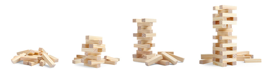 Playing Jenga. Wooden blocks and constructions on white background