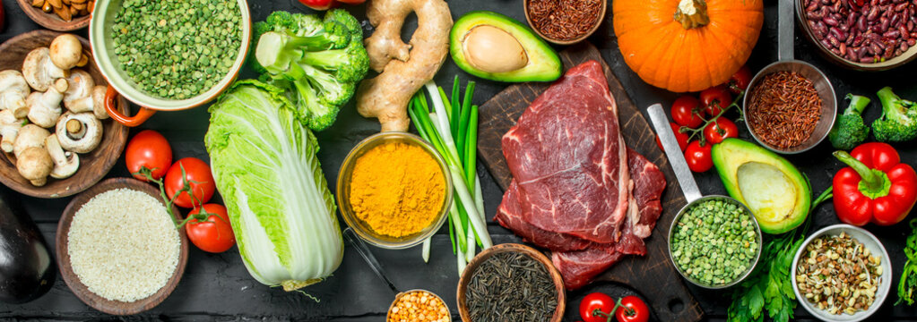 Healthy food. Organic food assortment with raw beef steaks .