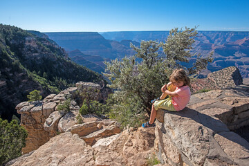 Kid on Grand Canyon. Child enjoy mountain in National Park. Canyon rock landscape. Monument valley,...
