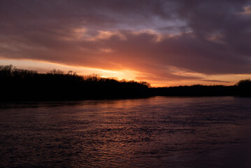 Colorful sunrise on large river