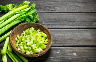 Pieces of celery in a wooden bowl.