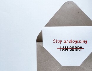 On white background, card in envelope writing I AM SORRY crossed off and remind to Stop...
