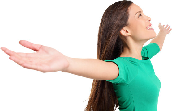 Free happy elated woman with arms out raised up in serene joyful pose. Girl in green shirt isolated in transparent PNG in studio. Mixed race Asian Caucasian female model.