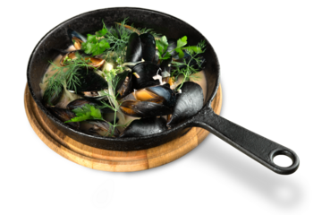 Copper pot of gourmet mussels served on a napkin garnished with fresh herbs for a tasty seafood meal