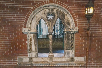 A Stone Arch Opening Of An Old Architecture Surrounded with Red Bricks