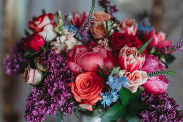 Vibrant colorful rich red, purple, orange color flower arrangement