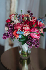 Vibrant colorful rich red, purple, orange color flower arrangement