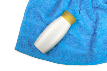 Suntan Lotion Bottle On Beach Towel