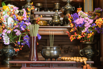 Fototapeta na wymiar 日本のお仏壇　香炉と線香の煙　Incense burner on Butsudan (household Buddhist altar) in Japanese house