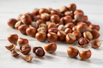 Hazelnut on a white kitchen table, selective focus.