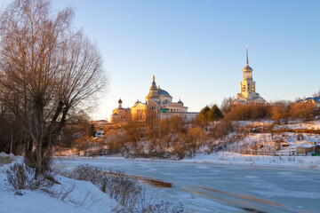Fototapeta na wymiar Ancient St.Boris and Gleb monastery in a winter landscape on a sunny January morning. Torzhok. Tver region, Russia