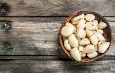 Cloves of garlic in a bowl.