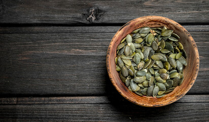 Pumpkin seeds in bowl.