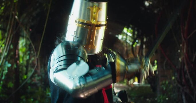 Medieval Knight Swinging a Sword and Advancing to the camera
