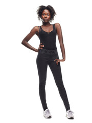 Fototapeta premium Fashion, portrait and African girl model in a studio with a casual outfit, confidence and natural pose. Beauty, young and proud black woman with an afro posing while isolated by a white background.