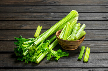 Pieces of celery in a wooden bowl.