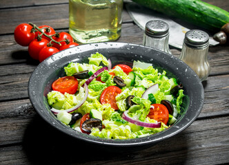 Vegetable salad. Salad of cucumbers, tomatoes and red onions with spices and olive oil.