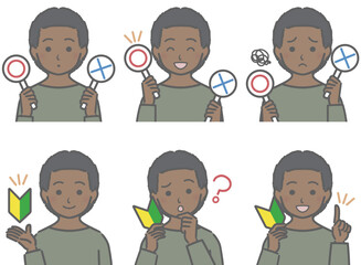 〇✕マークや初心者マークを持つ、黒人の子供