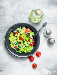 Vegetable salad. Salad of cucumbers, tomatoes and red onions with spices and olive oil.